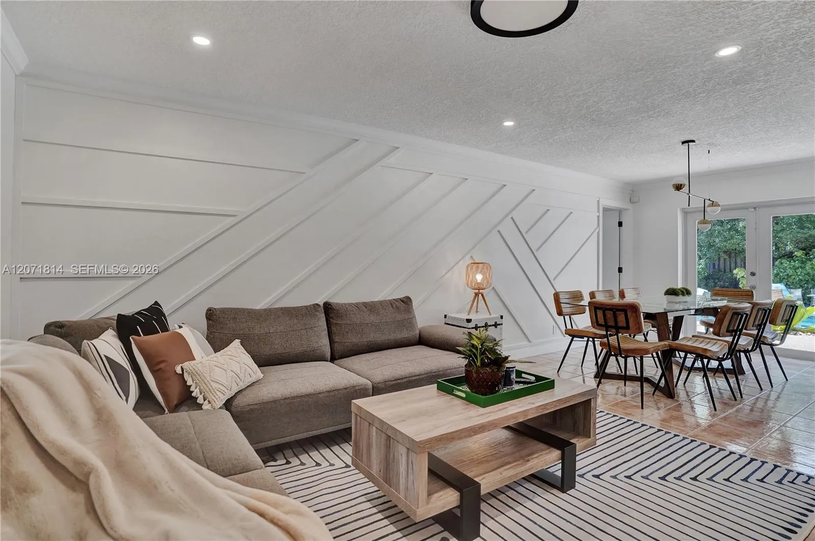 Open-concept living space seamlessly flowing into the dining area
