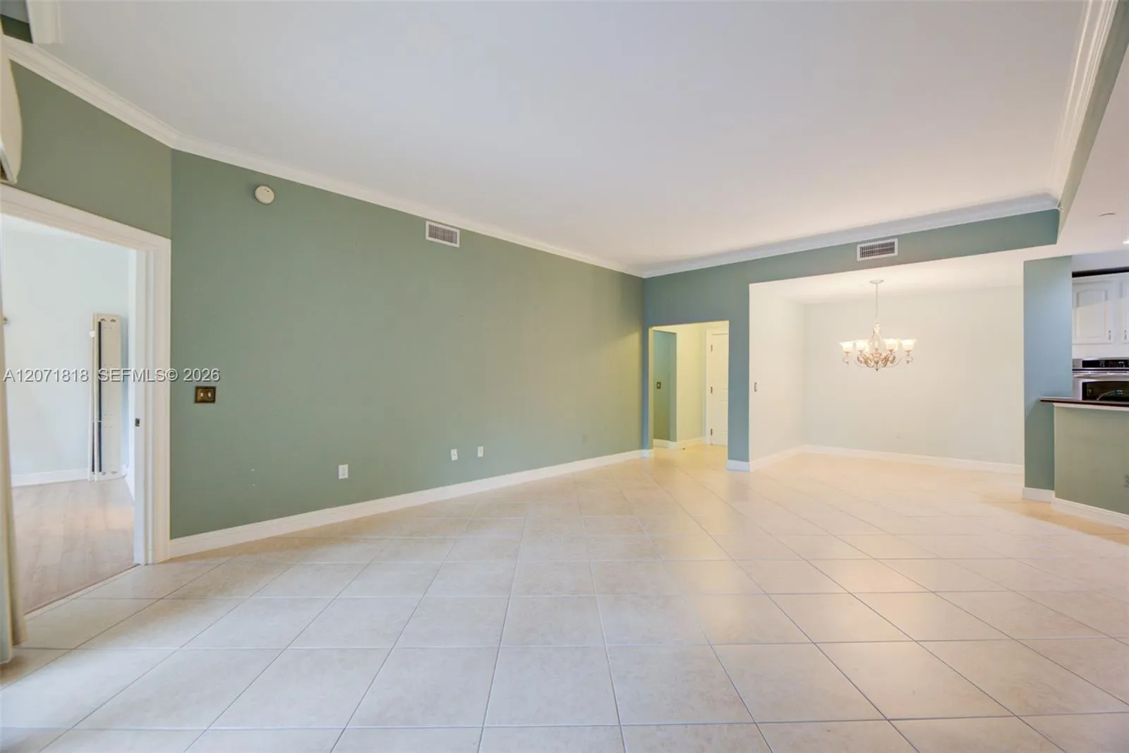 Left is entry to primary bedroom - note entry to left of front door leading to half bath, linen closet and laundry room