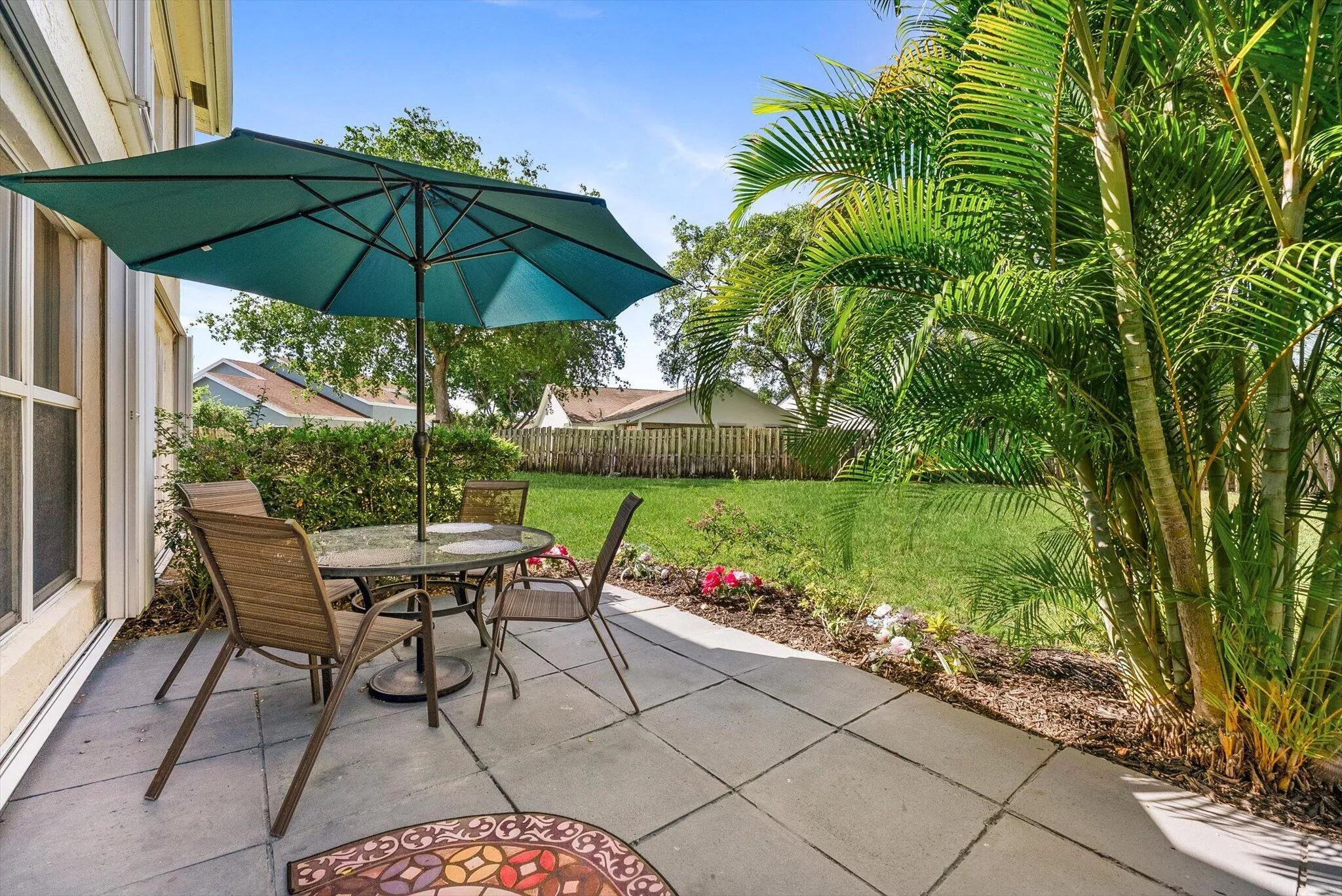 Personal Backyard with extended pavers and room for a grill, patio furniture, and outdoor living