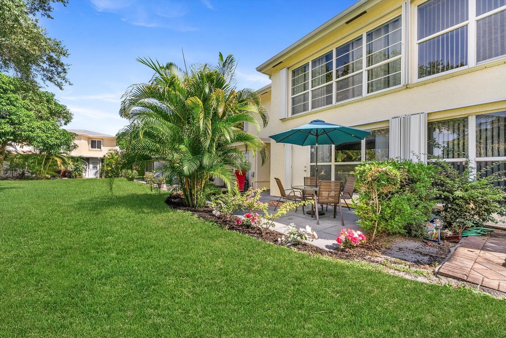 Personal Backyard with extended pavers and room for a grill, patio furniture, and outdoor living