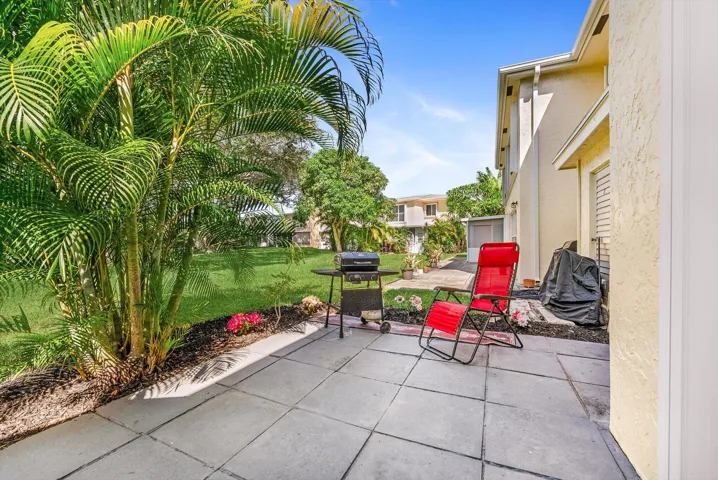 Extended back porch with space for Grills, Patio Furniture, and Outdoor living.