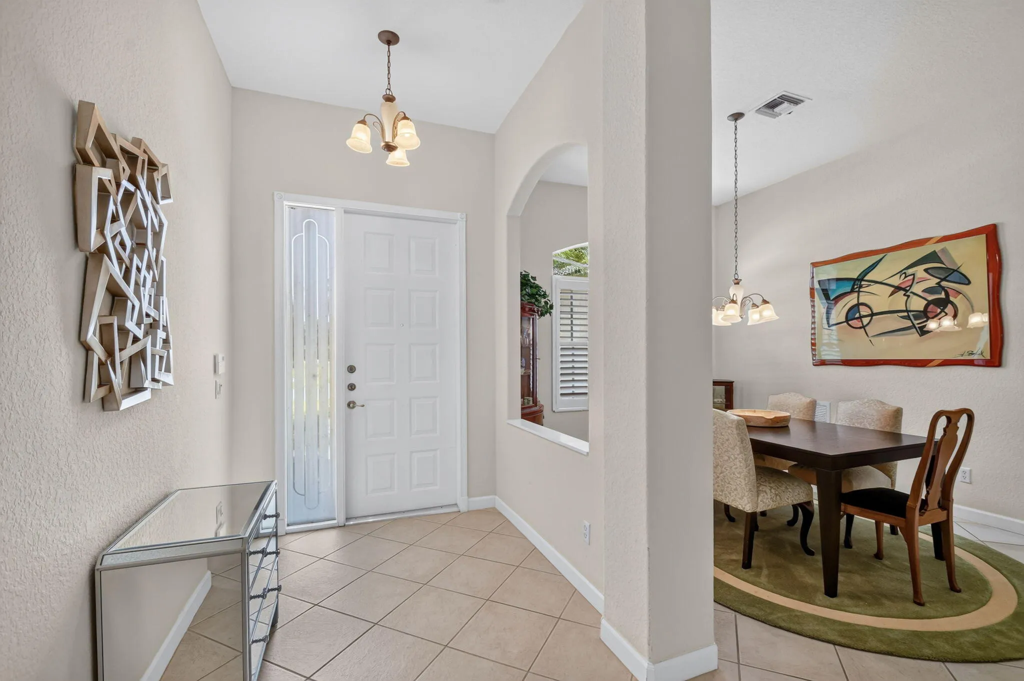 Love the cut out between the foyer and dining room!