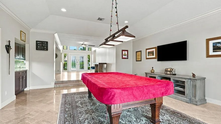 Gameroom Leads Out to Lakefront Lanai