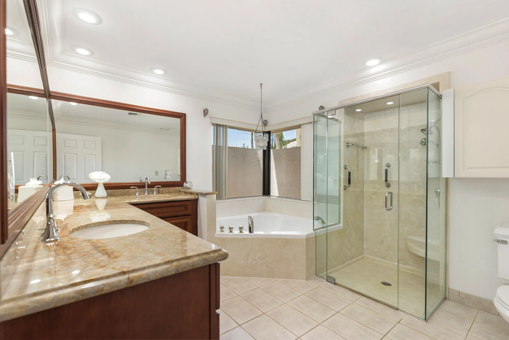 Master suite bathroom with frameless shower doors