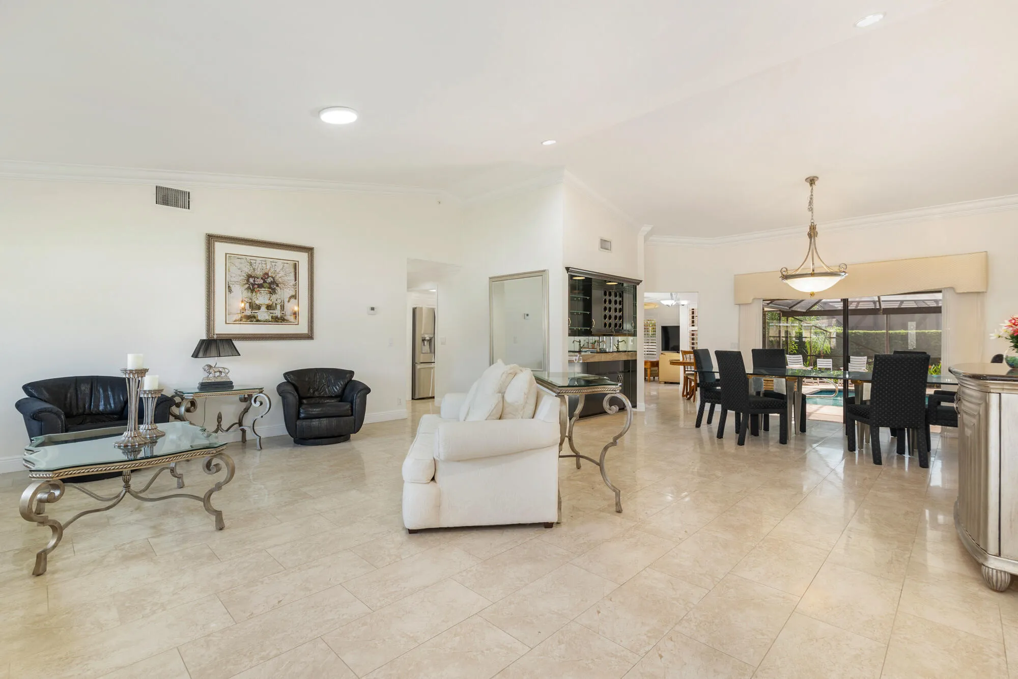 Easy Entertaining with wet bar overlooking pool & patio
