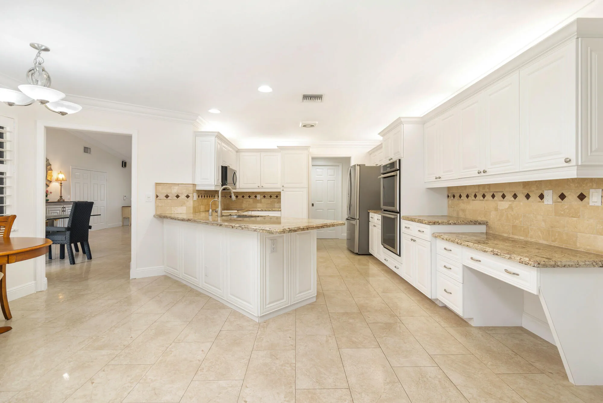 Large kitchen with working desk. granite counters
