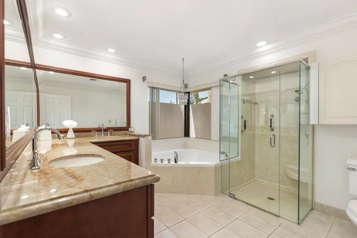 Master suite bathroom with frameless shower doors