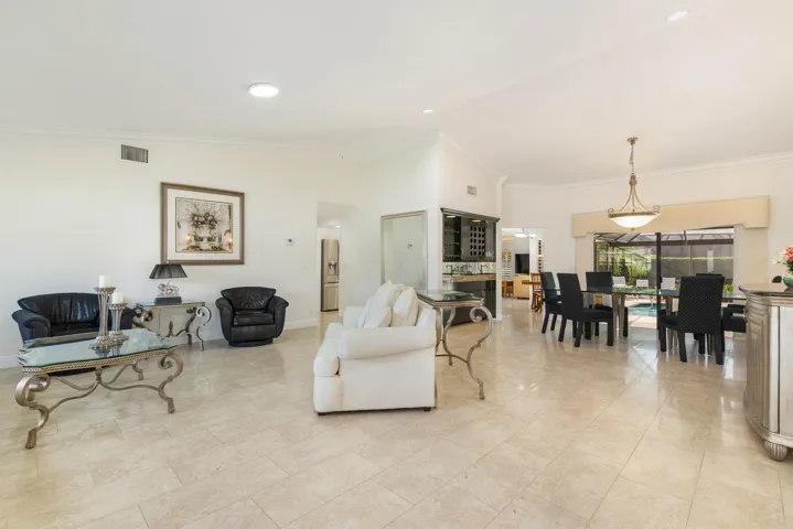 Easy Entertaining with wet bar overlooking pool & patio