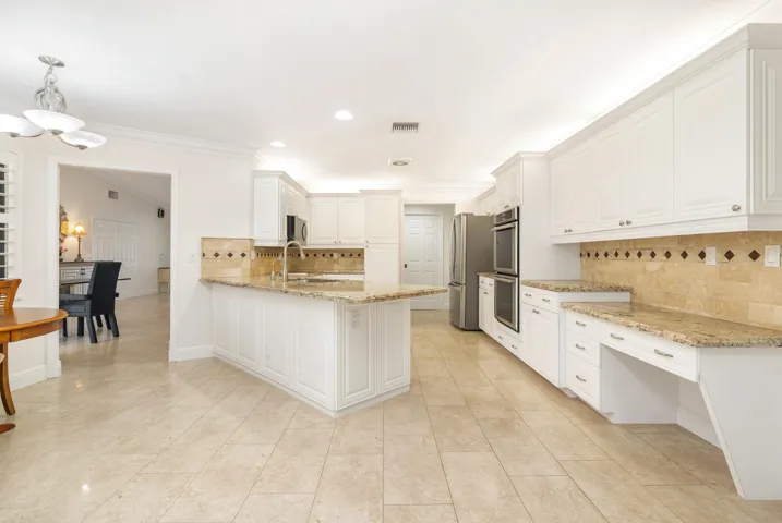 Large kitchen with working desk. granite counters