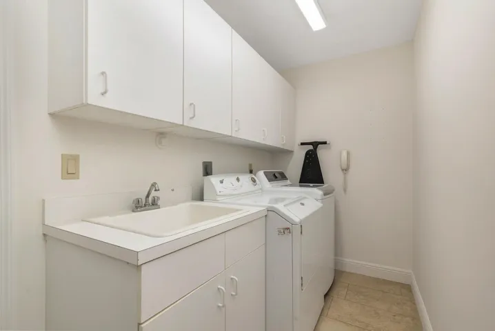 laudry room with full size washer & dryer & Tub sink