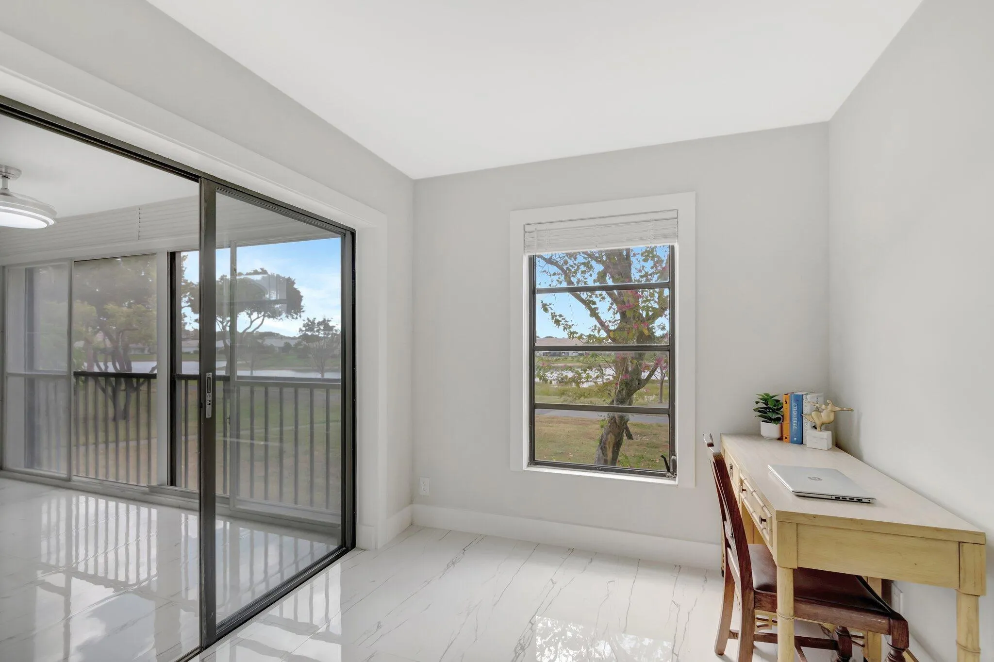 Small desk fits in corner of the primary bedroom by the window, but has been removed.