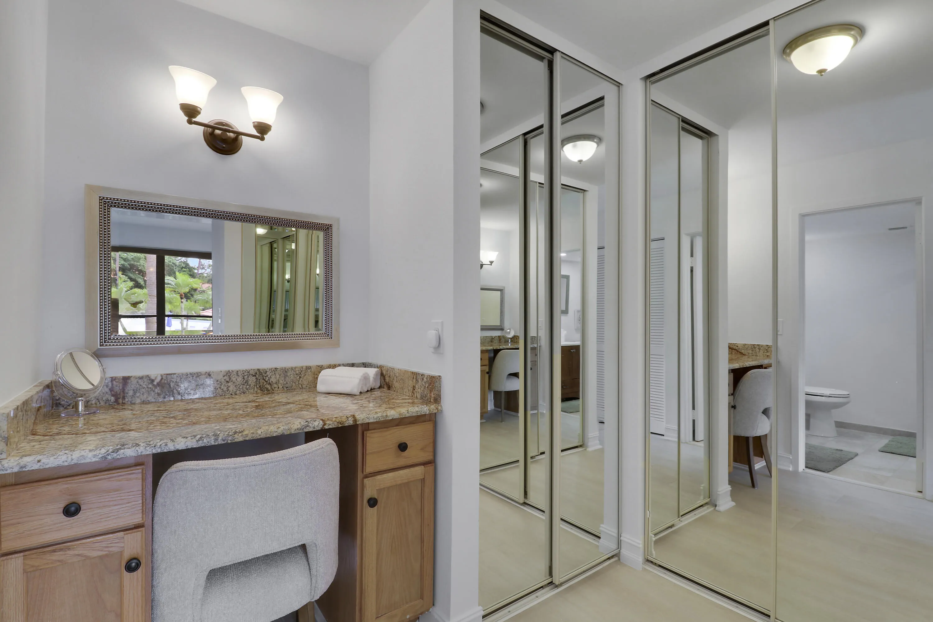 The master suite offers generous closet space and a vanity.
