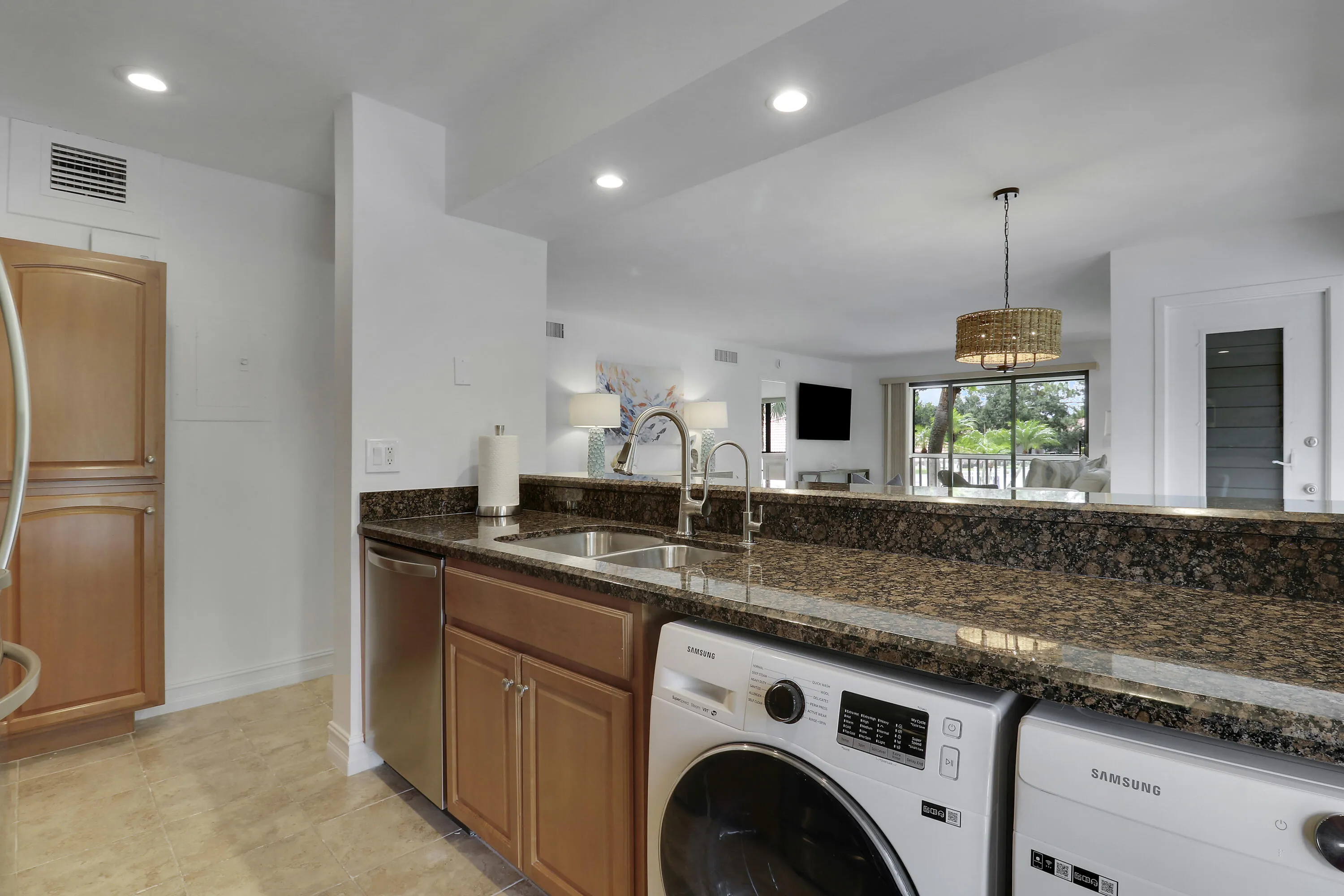 The kitchen is stocked with pots, pans, utensils, dinnerware and more.