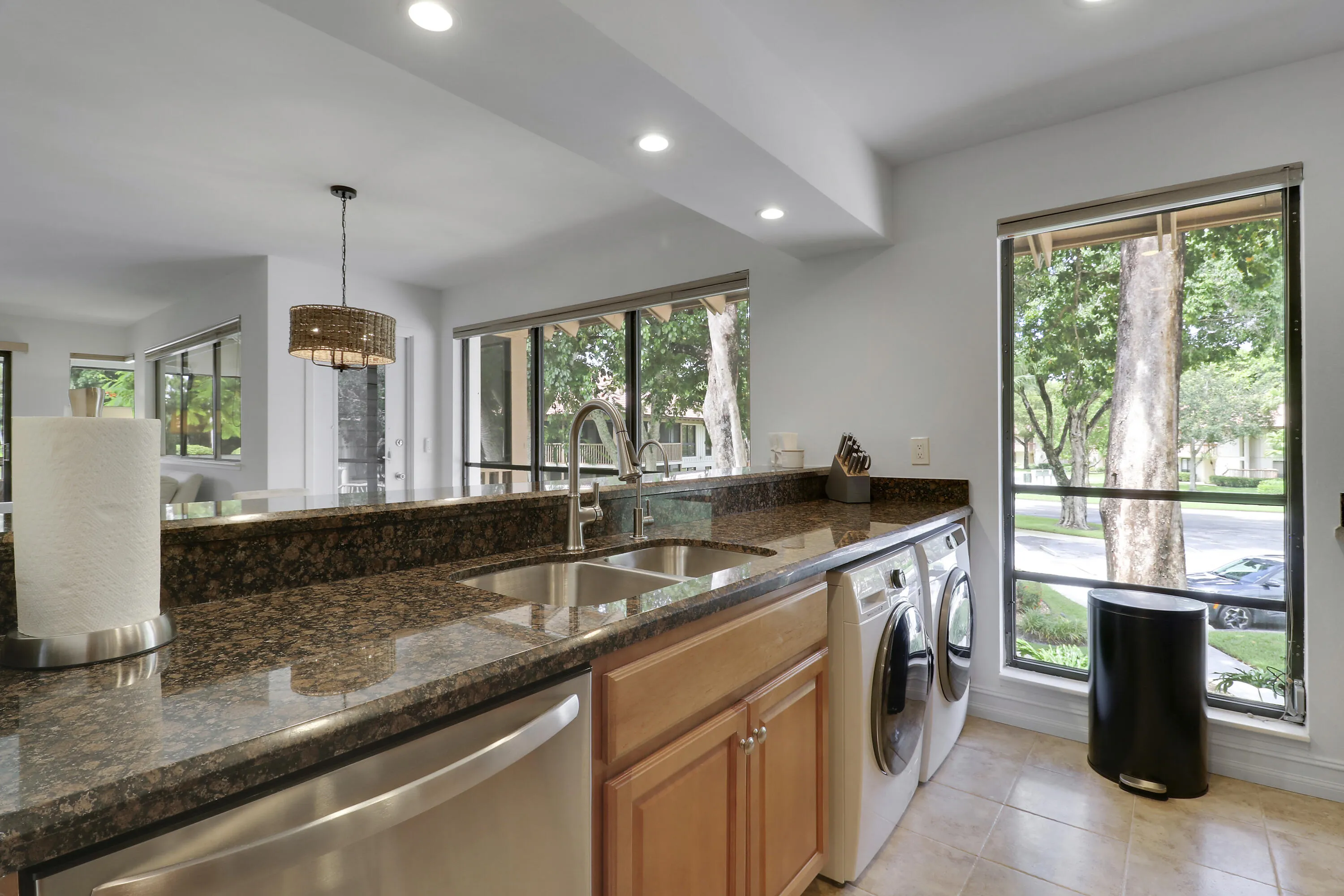 There is a dishwasher and full sized front load washer and dryer.