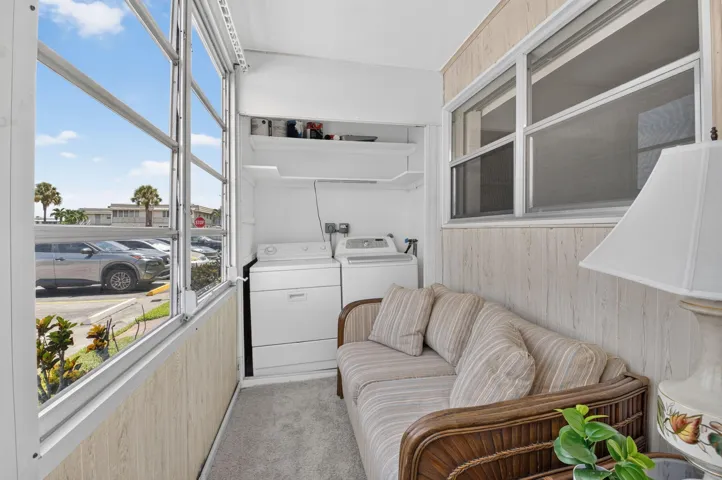 GLASS ENCLOSED LANAI WITH WASHER/DRYER