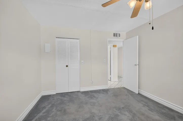 PRIMARY BEDROOM WITH WALK IN CLOSET