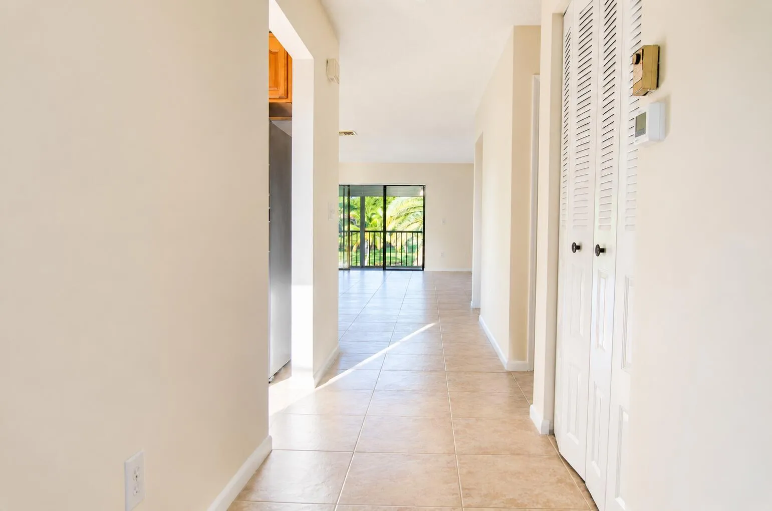 Kitchen on left. 2nd bedrm & bath immediately on right followed by alcove/bar & then Master Bedroom & Bath