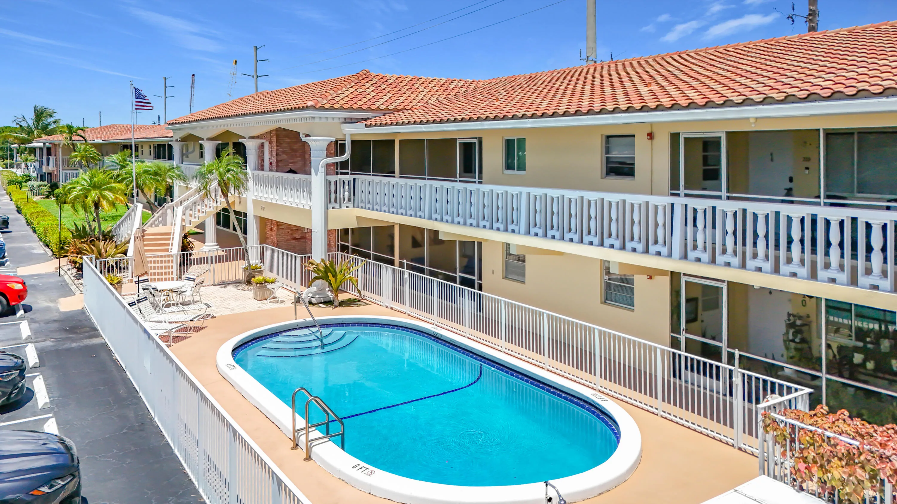 Oval-shaped swimming pool with a surrounding deck