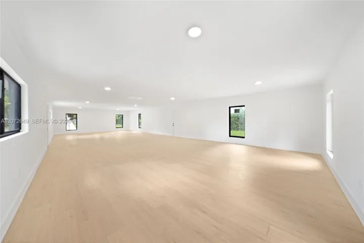 Guest Quarters, Left as a white canvas, can be converted into a 3/2 guest house, gym, playroom, man cave or and office.