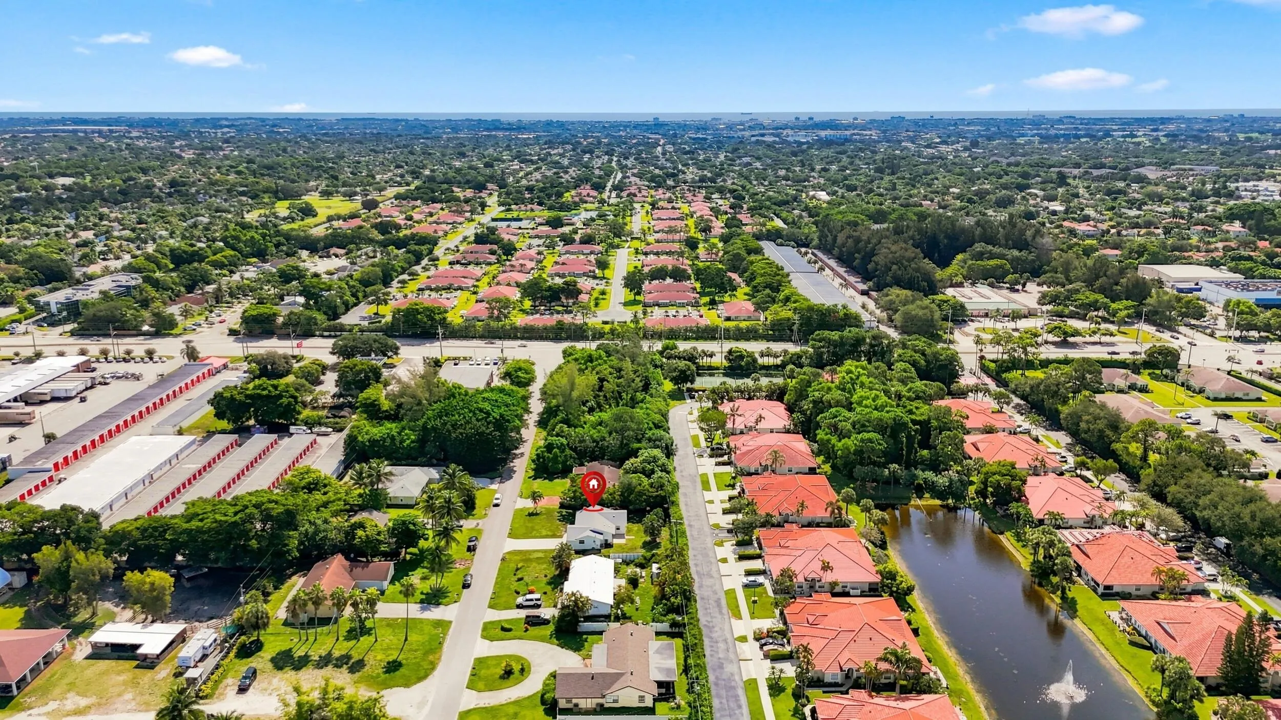 Aerial view showcasing the surrounding neighborhood and nearby community.