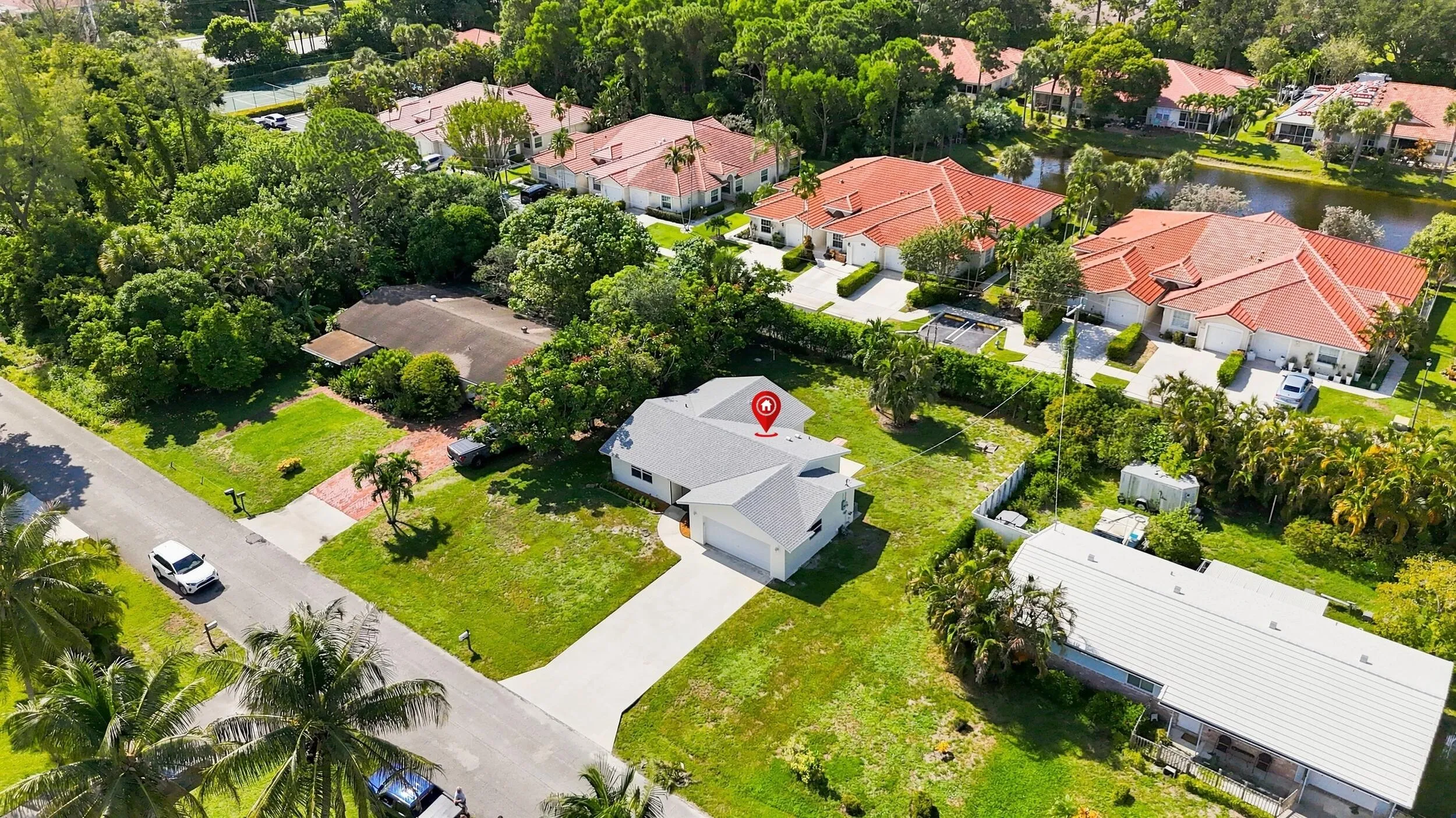Elevated aerial view highlighting the property and its surrounding residential neighborhood.