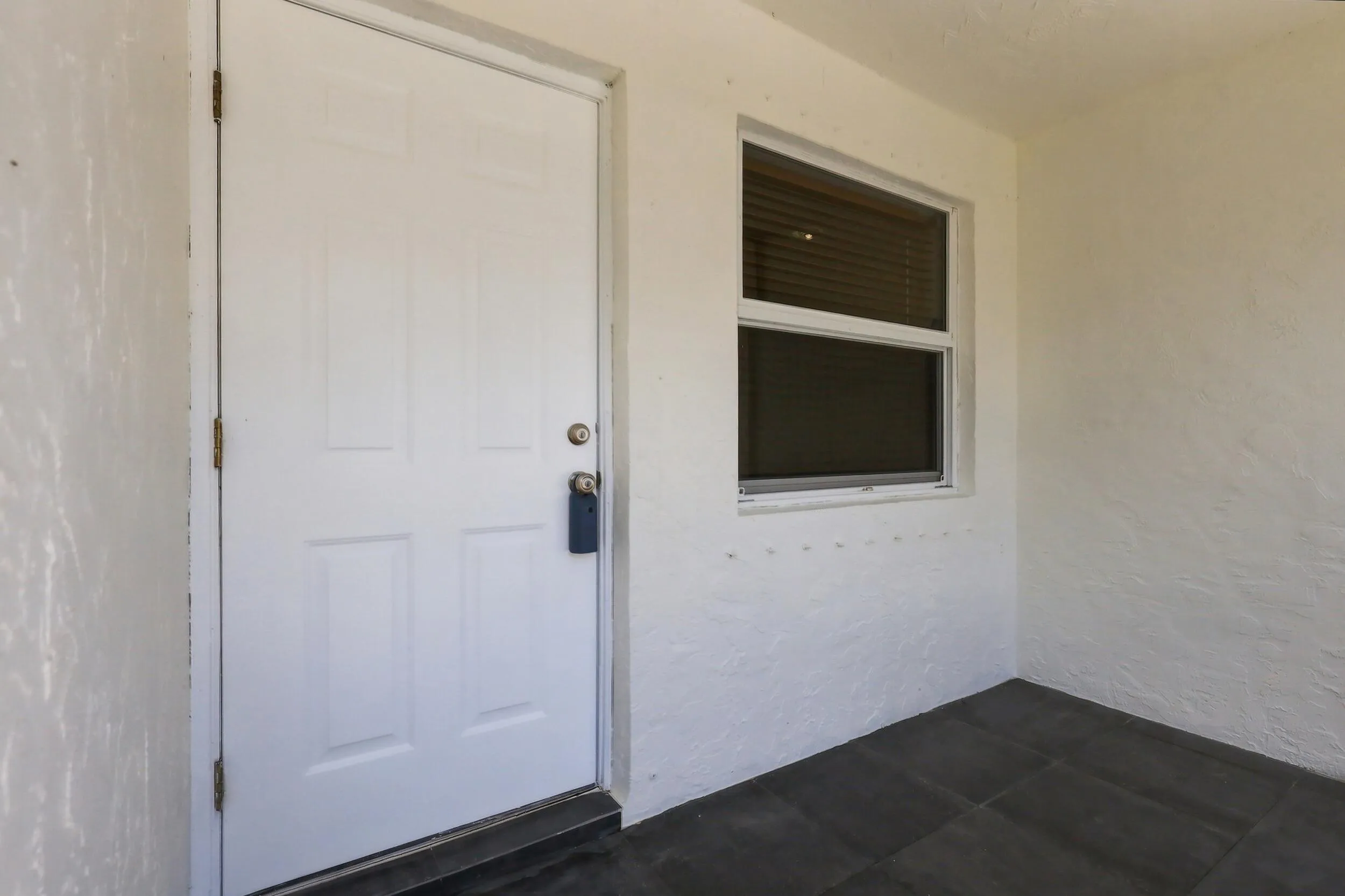 Covered front entry with convenient access into the home.