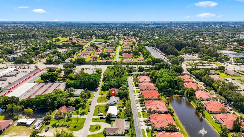 Aerial view showcasing the surrounding neighborhood and nearby community.