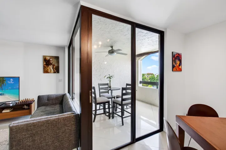 covered outdoor patio overlooking tennis courts