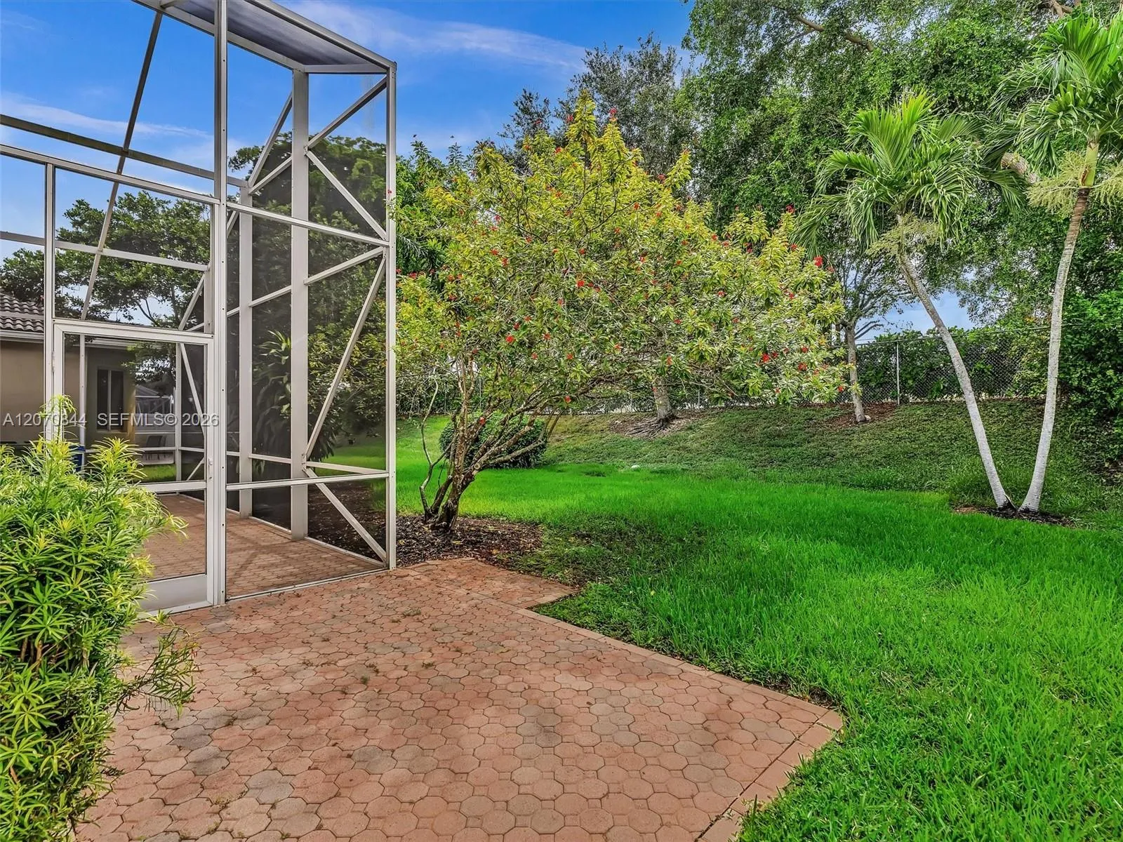 Versatile secondary patio space ideal for grilling, entertaining, or creating your own outdoor setup.