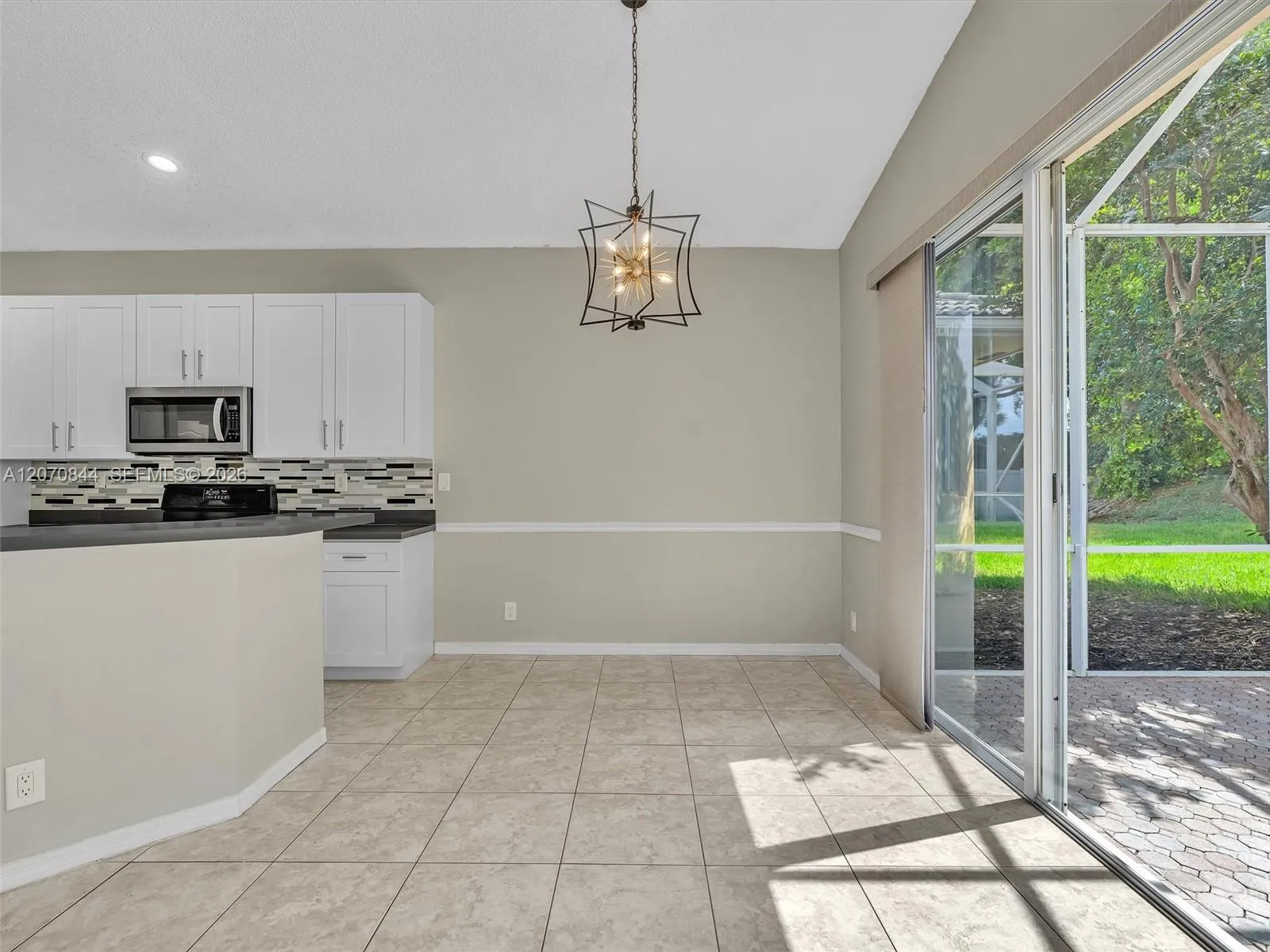 Bright eat in kitchen providing a comfortable space for casual dining and morning coffee.