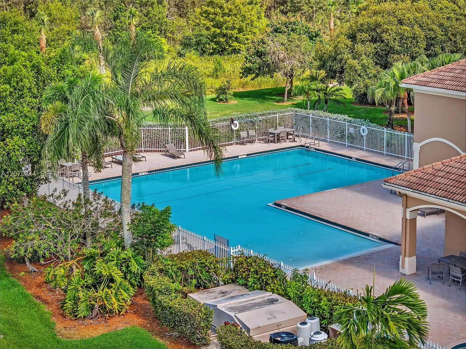 Resort-style community ammenities, including a sparkling community pool, perfect for enjoying the Florida lifestyle.