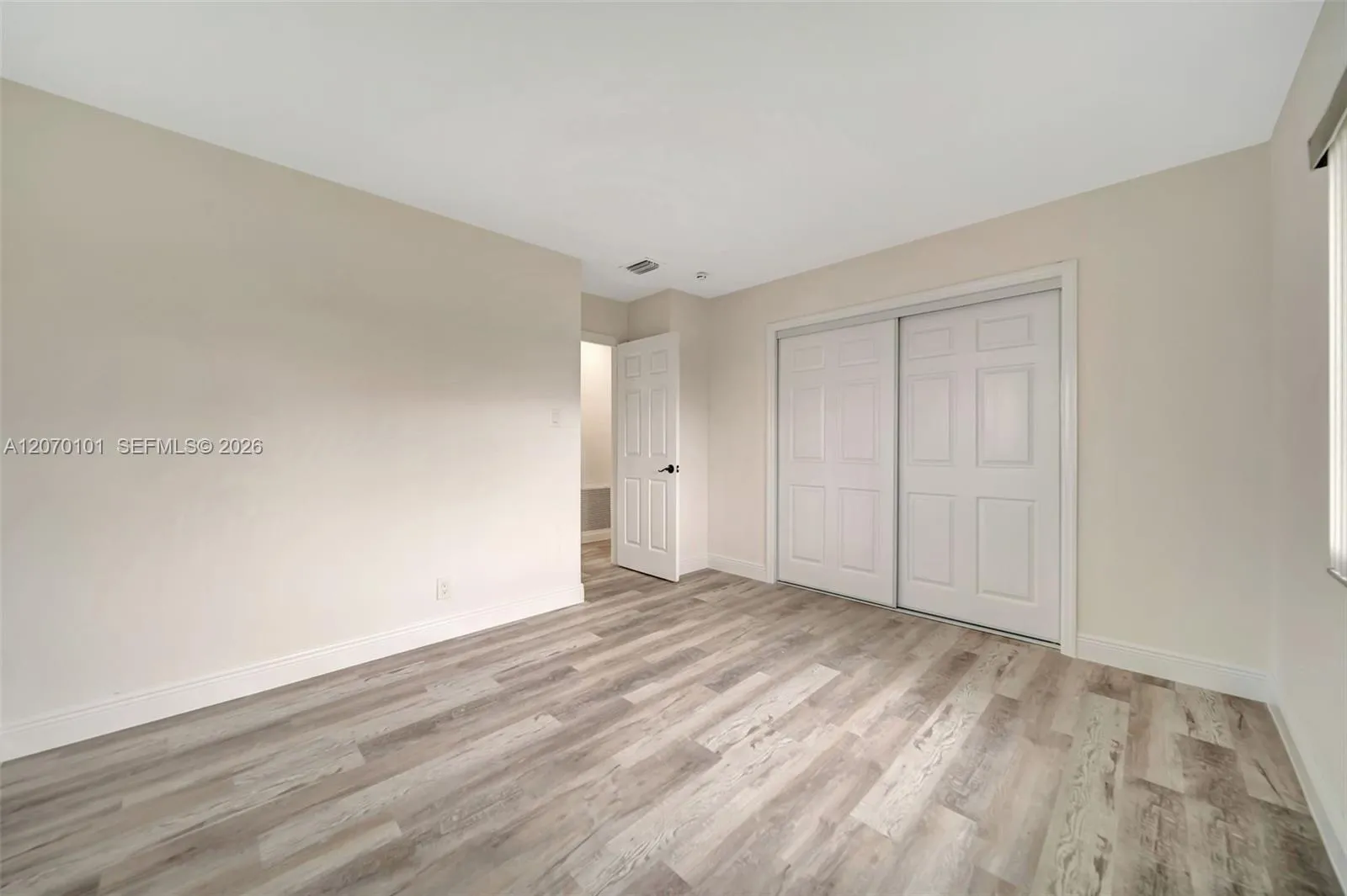 Closet doors, door to hallway/bath