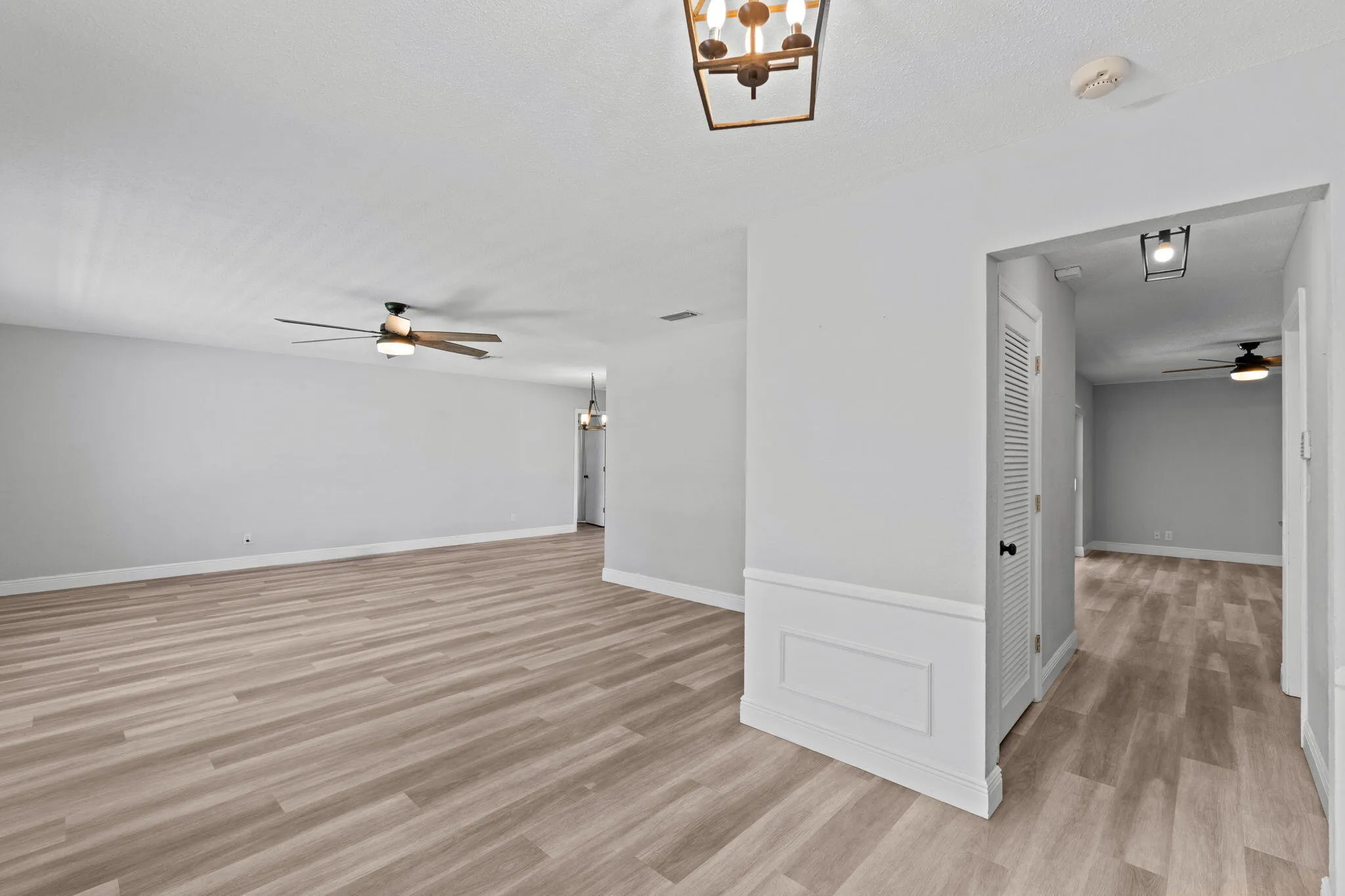 Upon entrance to the home, Living Room to to the left. Large pantry/Closet in the hall, through the hall opens to the Family Room.