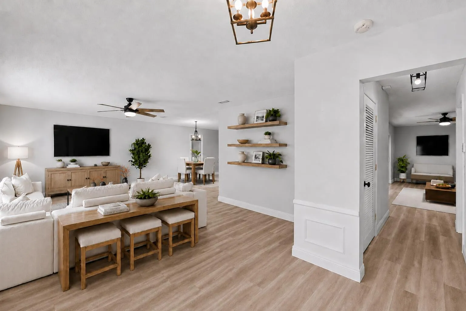 Upon entering the home, Living Room to to the left. Large pantry/Closet in the hall, through the hall opens to the Family Room. Virtually Staged.