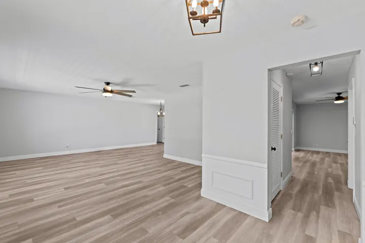 Upon entrance to the home, Living Room to to the left. Large pantry/Closet in the hall, through the hall opens to the Family Room.