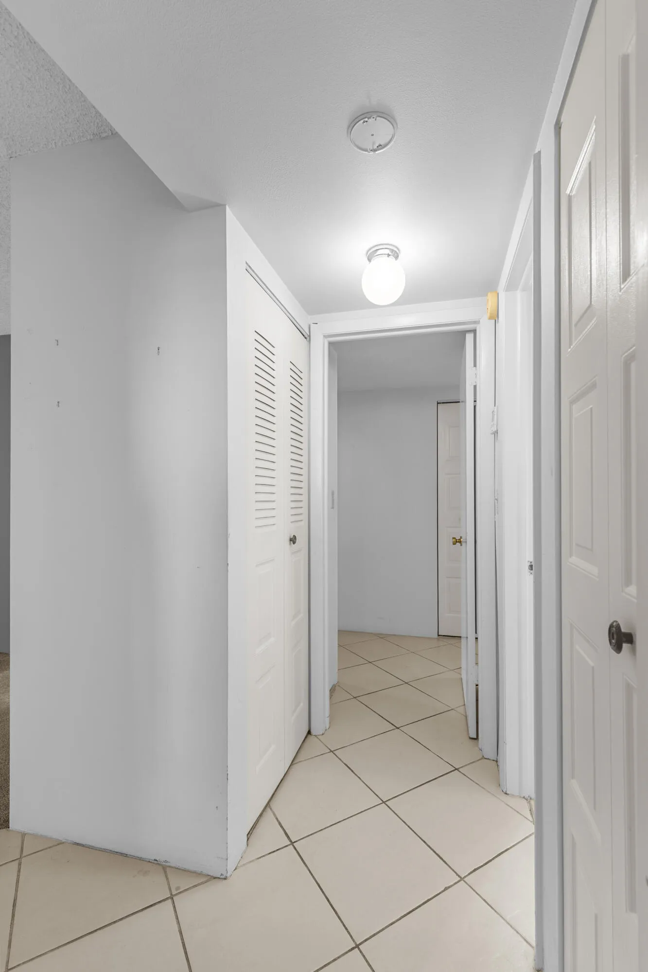 hallway between two bedrooms