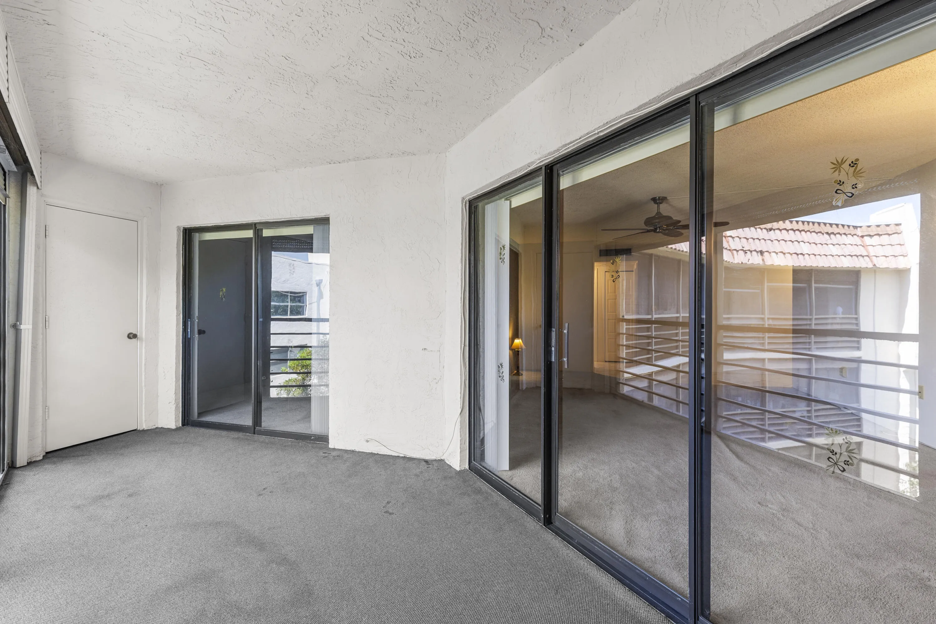Covered screened balcony- balcony has storage closet