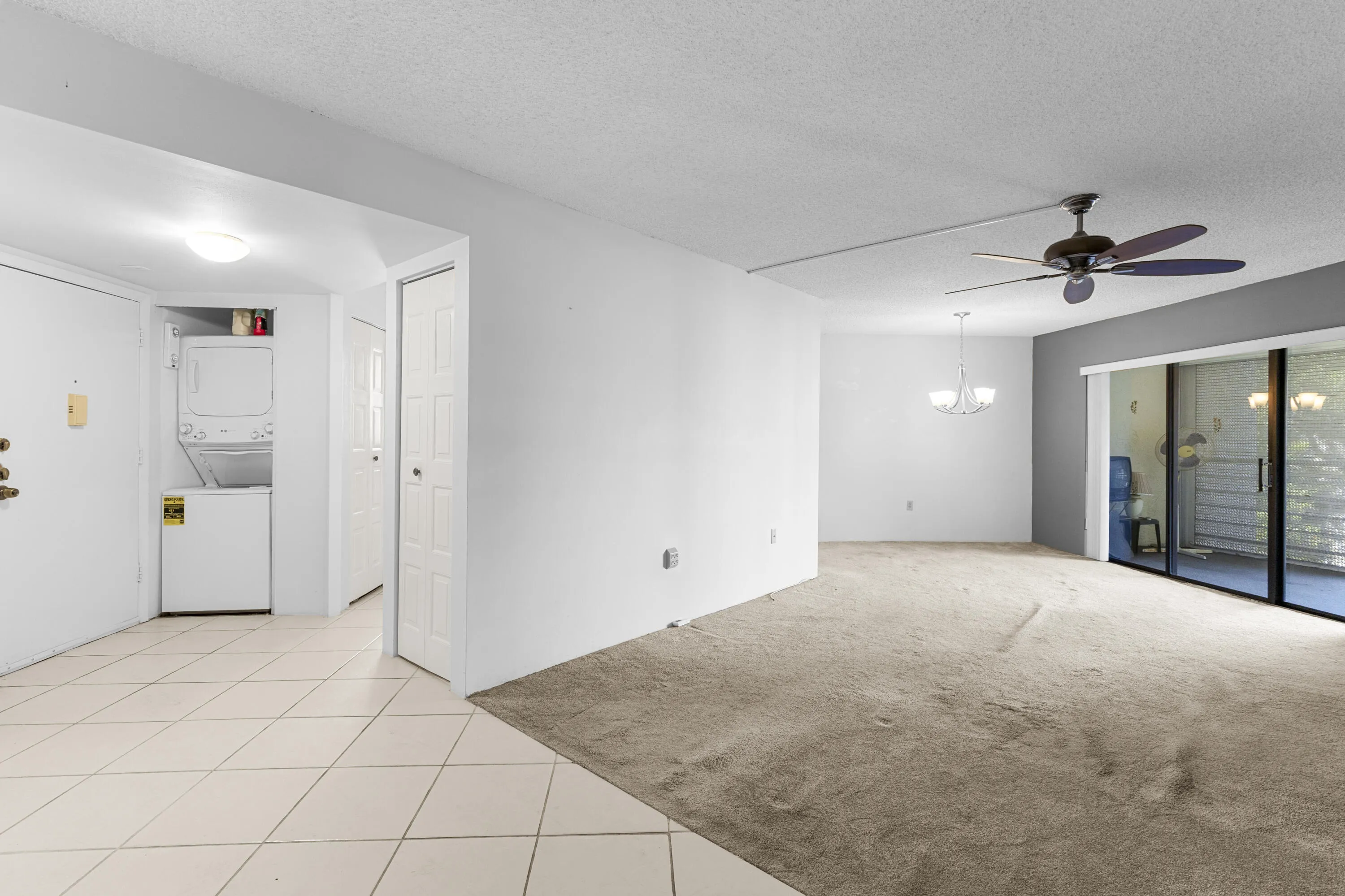 Sliders in family room open up to a large covered screened balcony (balcony has storage)