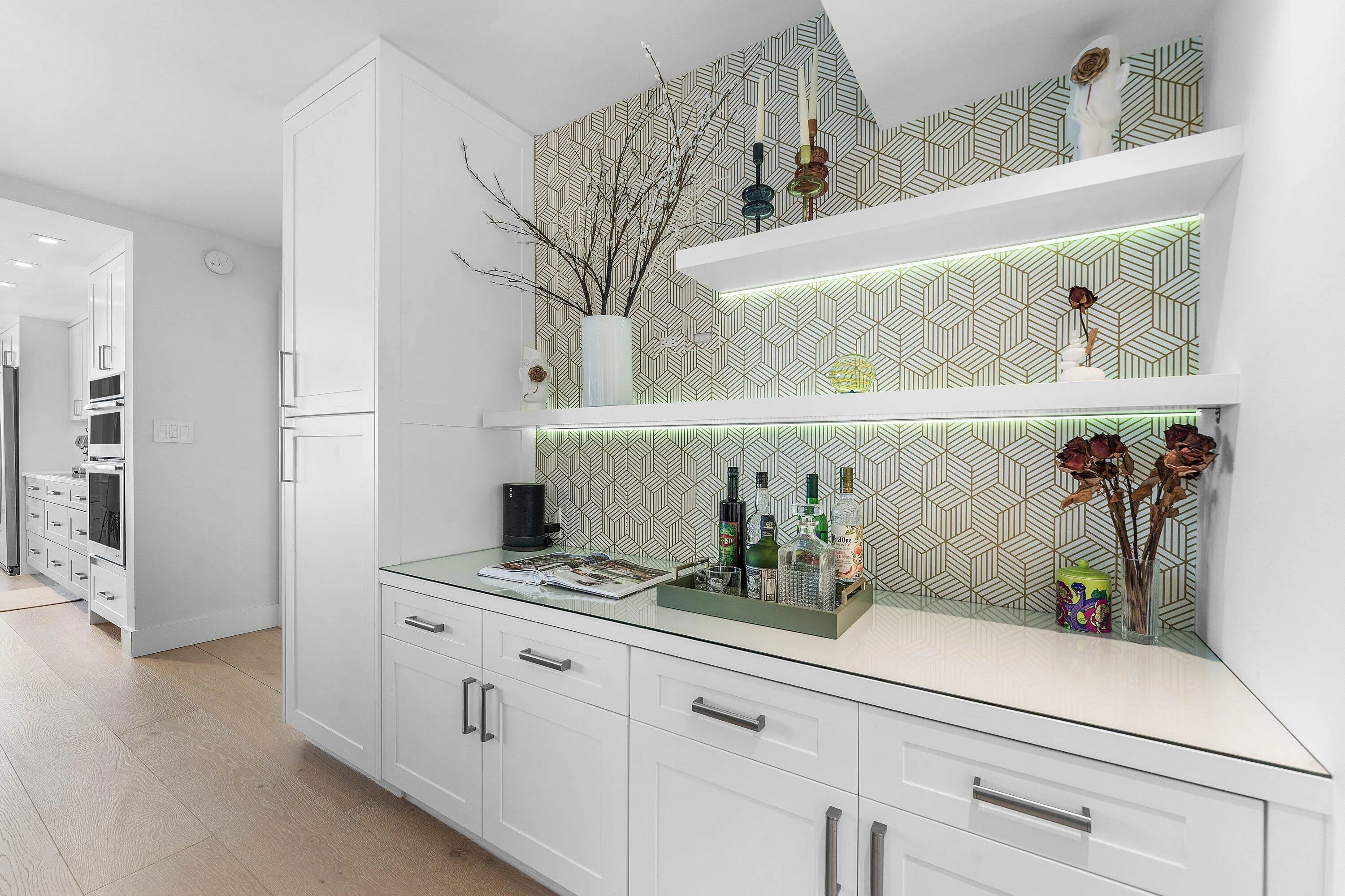 Custom built-in cabinetry with white shaker-style doors and dark hardware