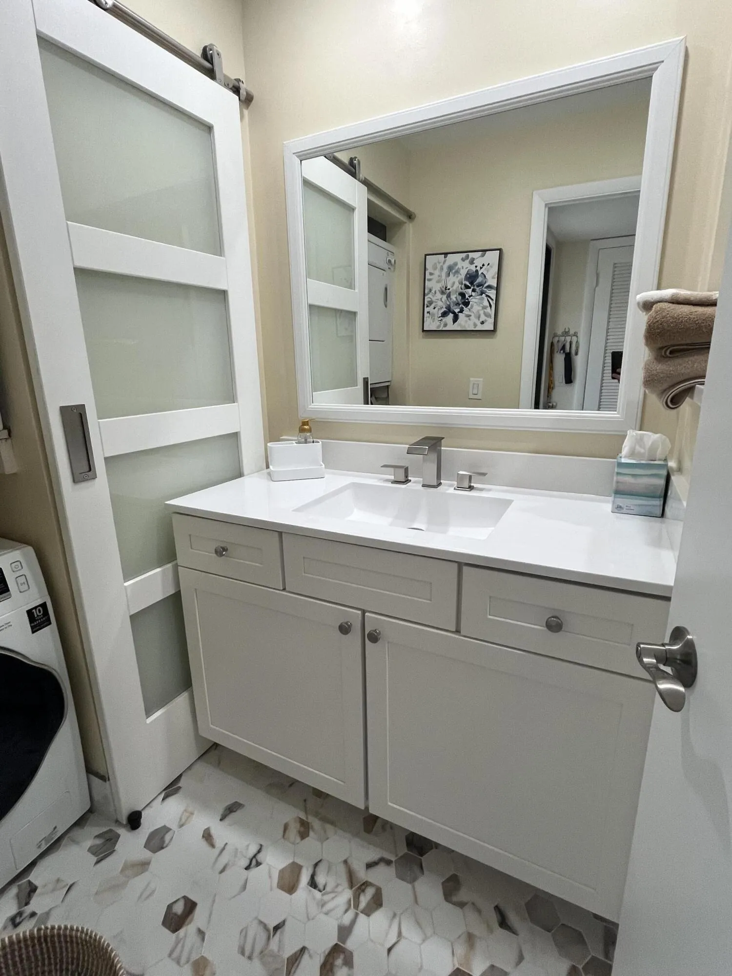 updated guest bathroom, located directly across from front guest/2nd bedroom.