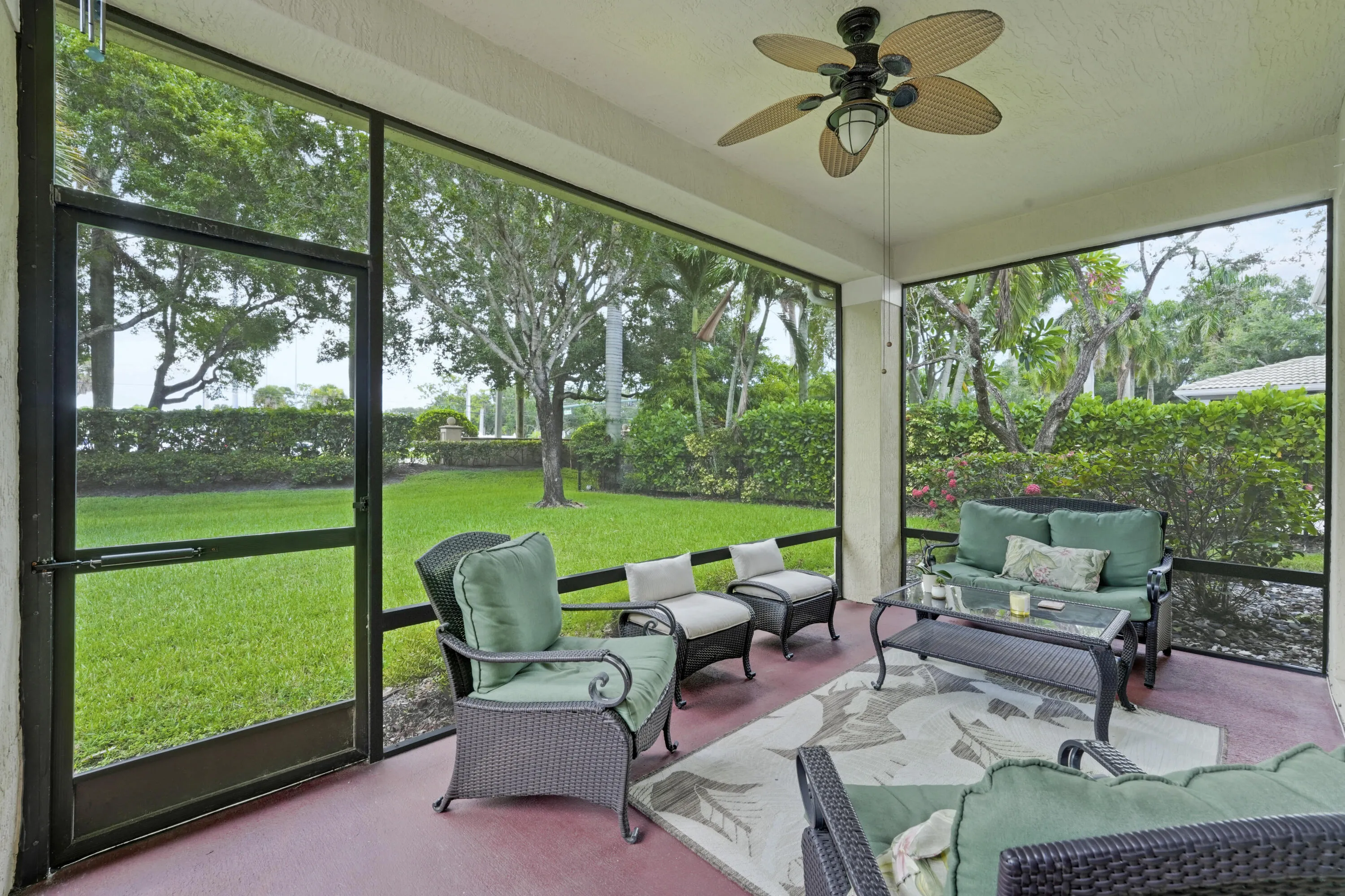 Covered and screened patio creates a comfortable outdoor gathering space