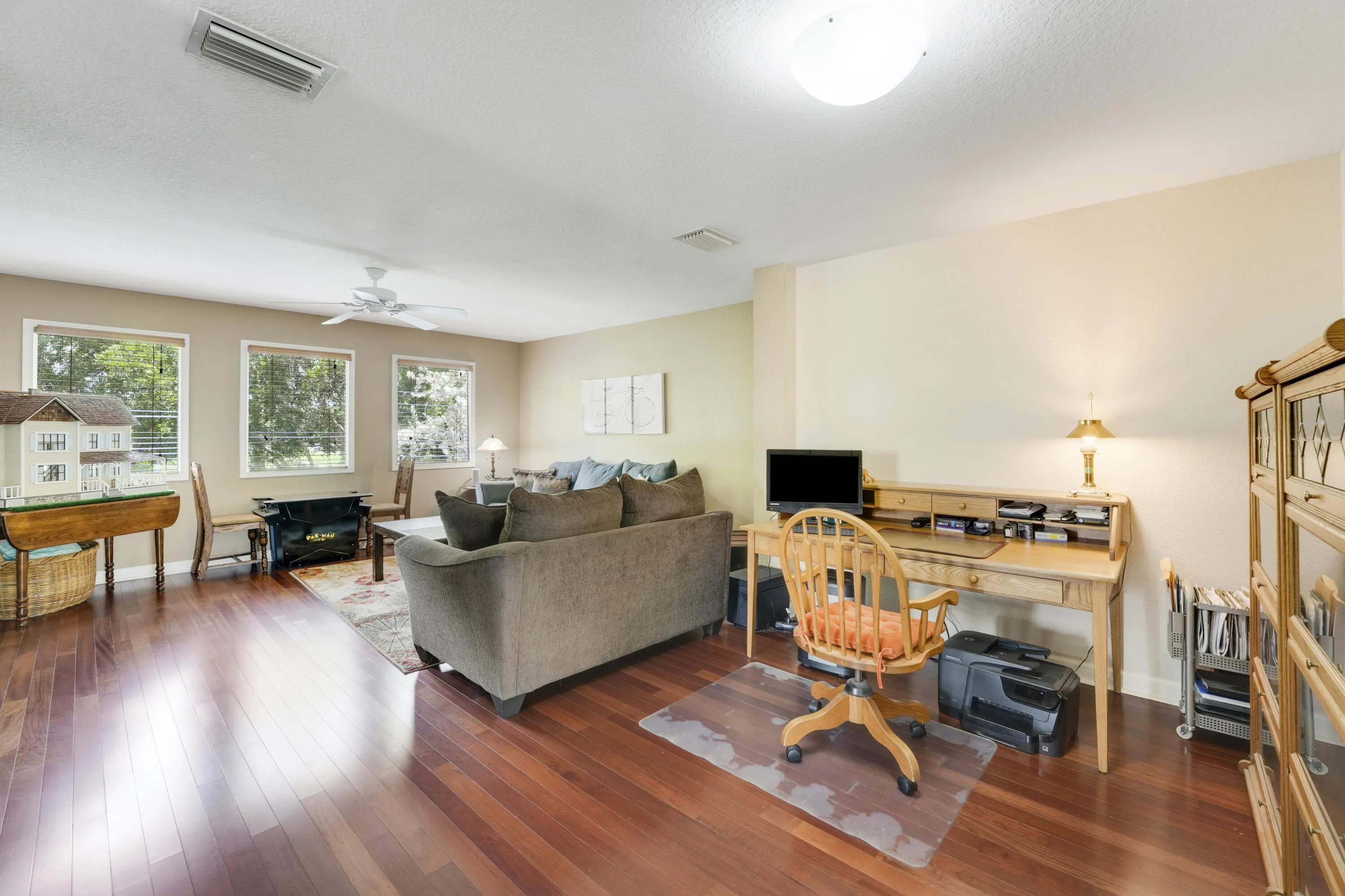 Expansive upstairs loft offers room for lounging, entertainment and a workspace