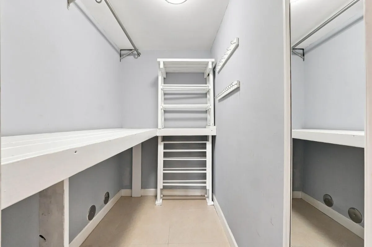 Primary bedroom walk-in closet