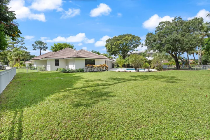 Fenced Yard with Expansive Green Space
