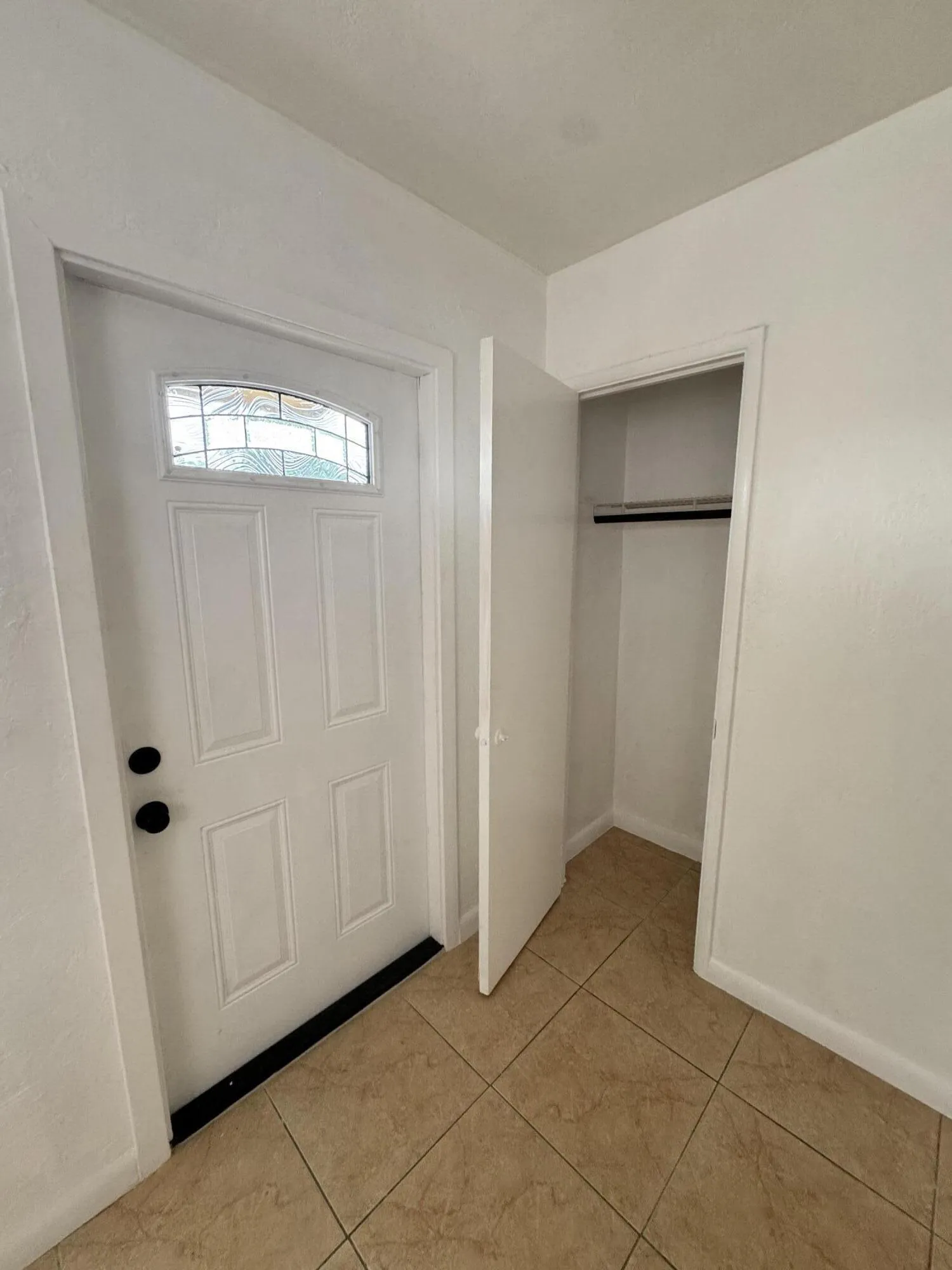 Convenient living room closet provides additional storage in this affordable Fort Lauderdale home. A practical feature for a first time homebuyer.