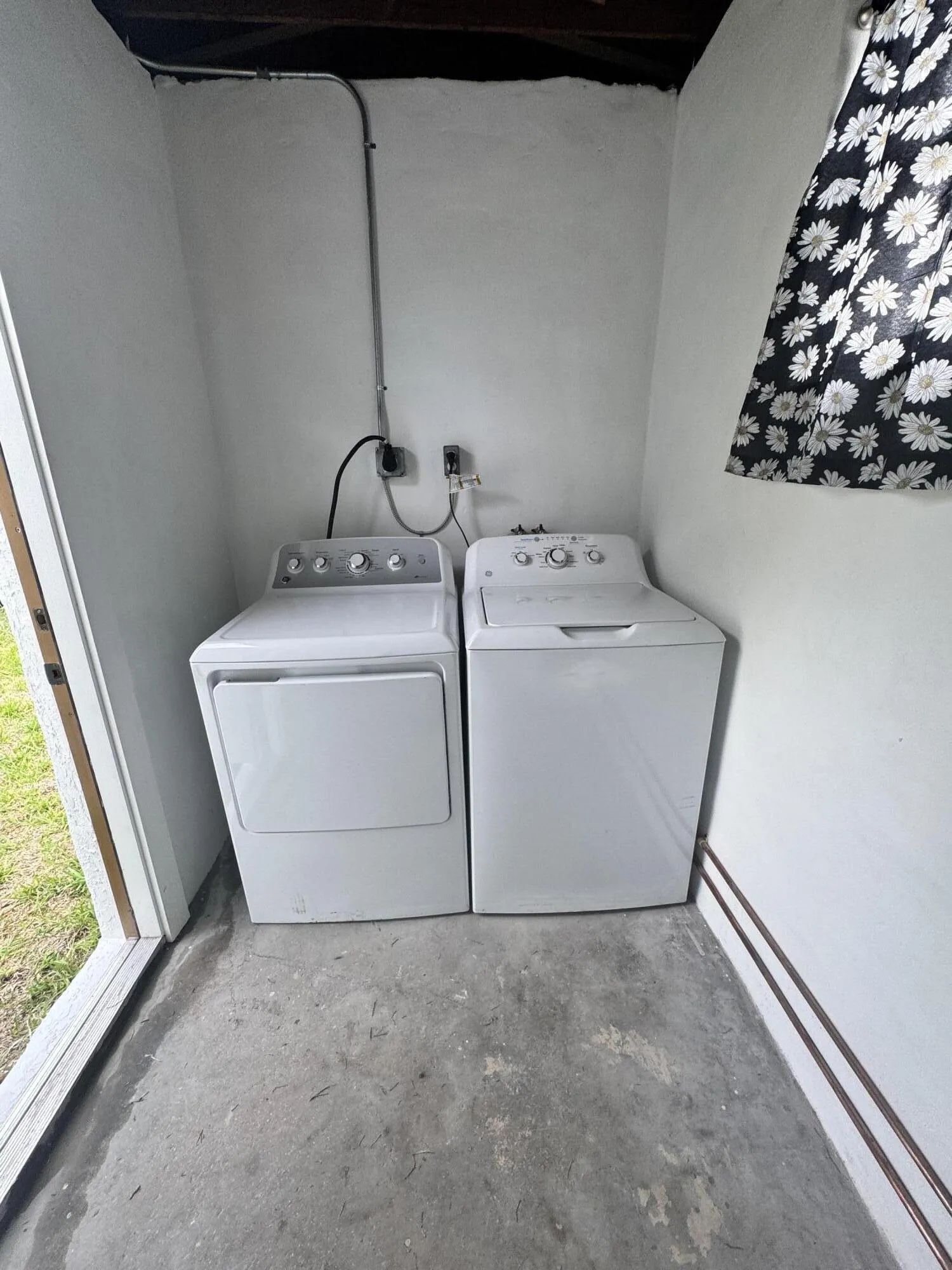 Spacious attached laundry and utility area with washer and dryer and room to add shelving, storage racks or additional organization to fit your needs.