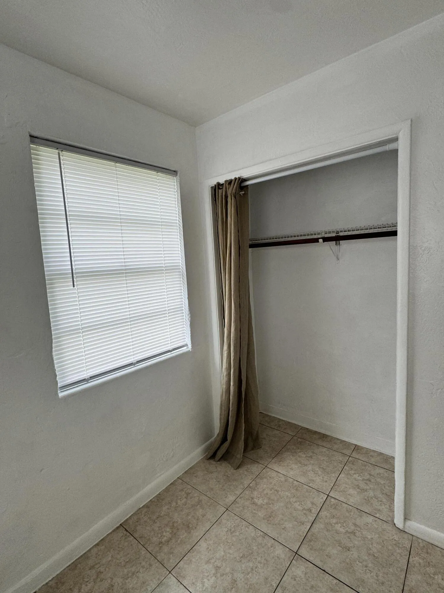 Spacious bedroom closet provides plenty of convenient storage. Great use of space for a first time homebuyer looking for an affordable Fort Lauderdale home.