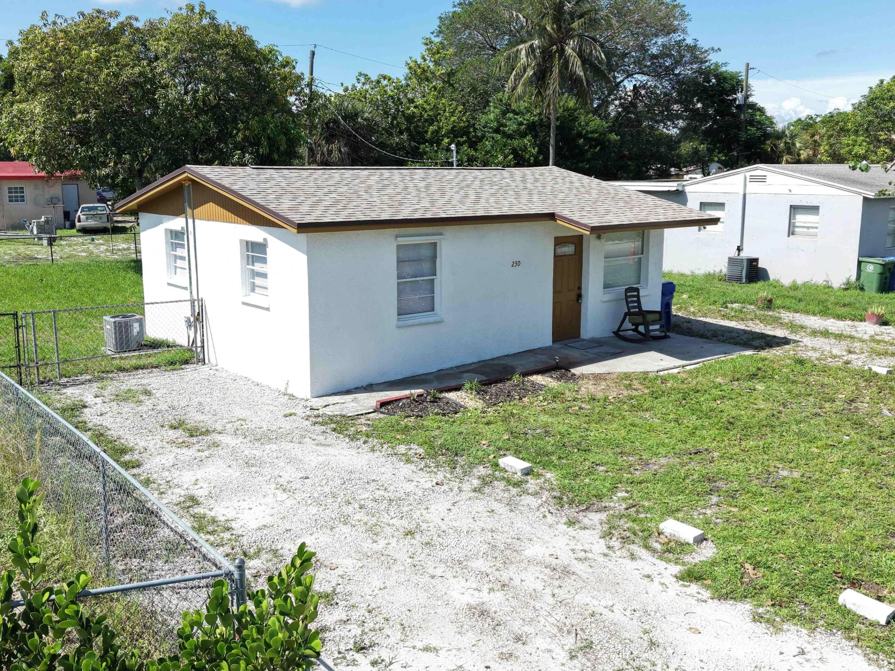 Aerial view highlights the new roof, ample off street parking and large fenced lot. Excellent setup for multiple vehicles, a boat, recreational vehicles and your toys.