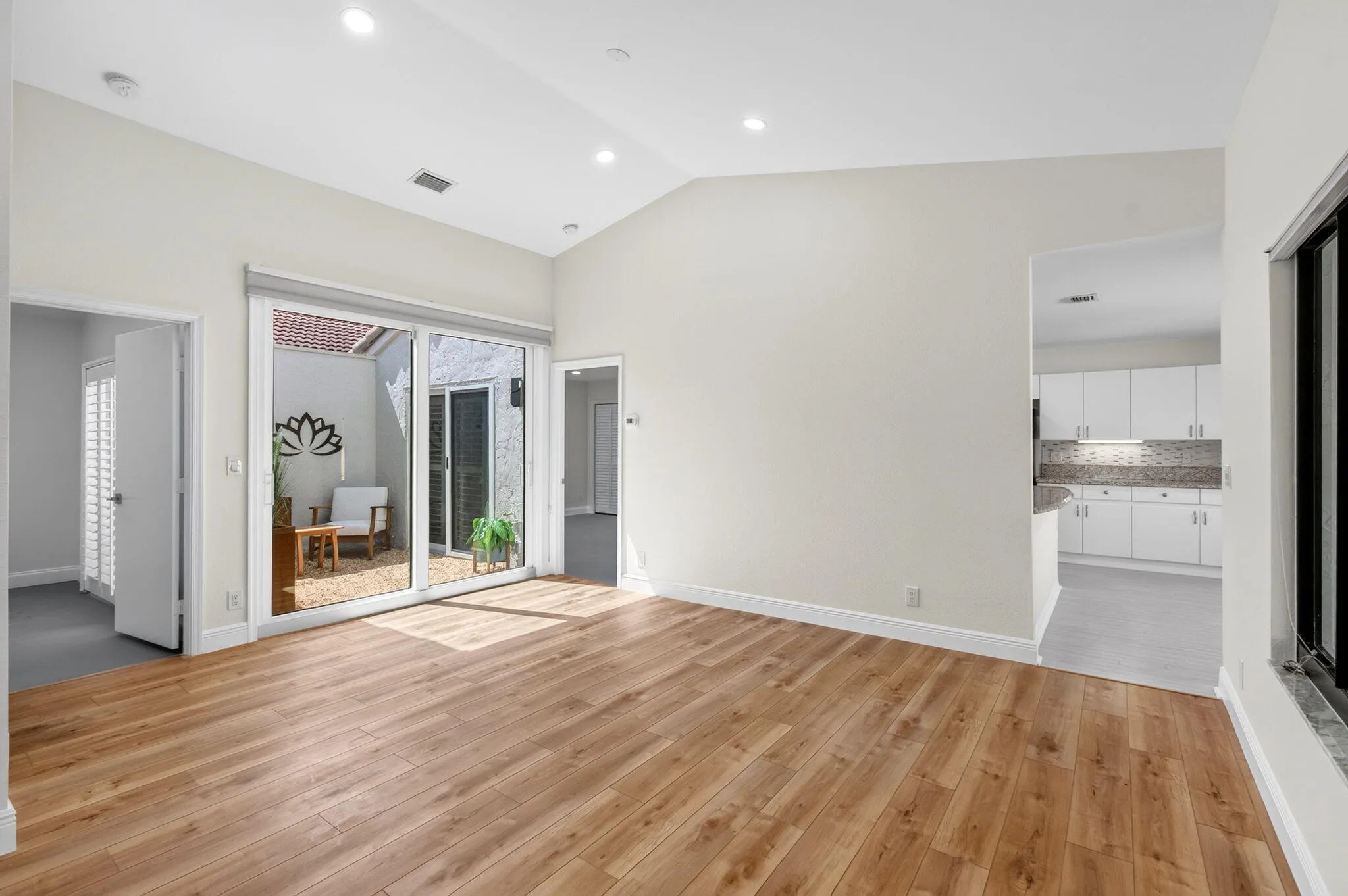 with View of Atrium & Entry to Kitchen & Guest Bedroom