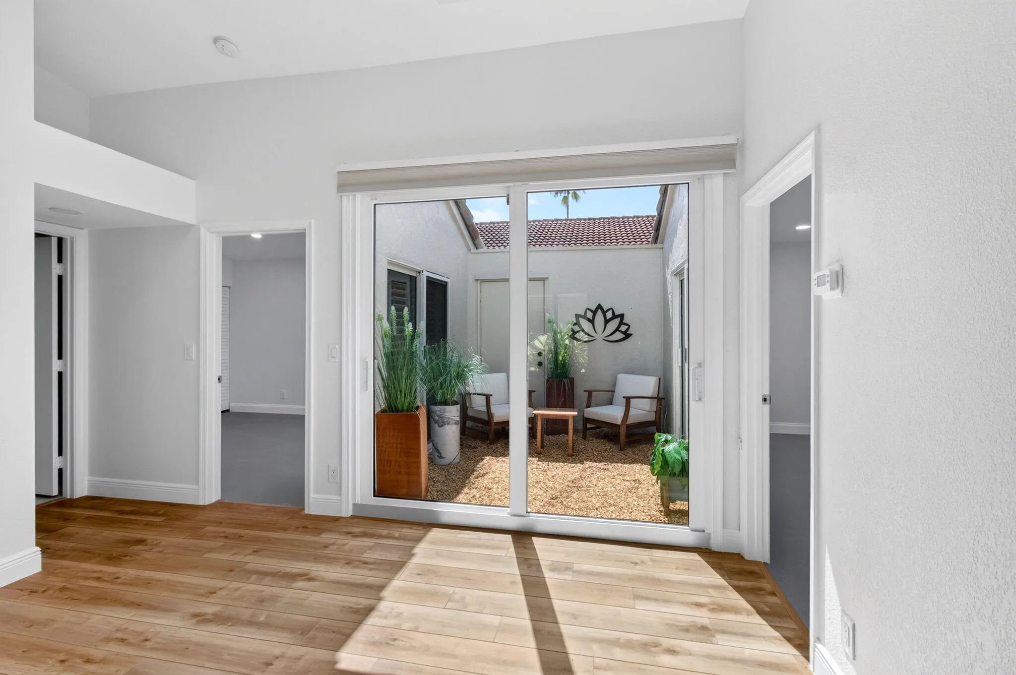 with View of Atrium & Entry to Guest Bedroom